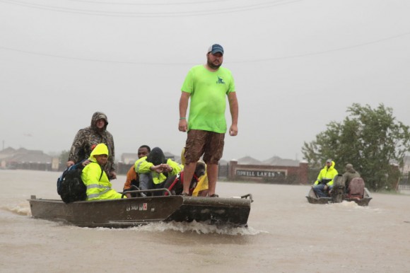People are rescued from a flooded neighborhood after it was inundated with rain water, remnants of Hurricane Harvey, on August 28, 2017 in Houston, Texas. Harvey, which made landfall north of Corpus Christi late Friday evening, is expected to dump upwards to 40 inches of rain in areas of Texas over the next couple of days. (Scott Olson/Getty Images)