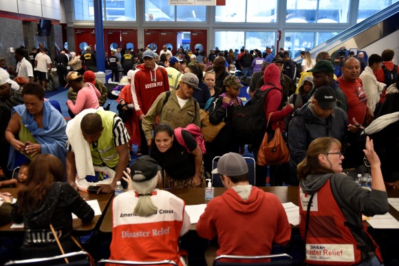 Volunteers with The American Red Cross register evacuees at the George R. Brown Convention Center after Hurricane Harvey inundated the Texas Gulf coast with rain causing widespread flooding, in Houston, Texas, U.S. August 28, 2017.  (Reuters/Nick Oxford)