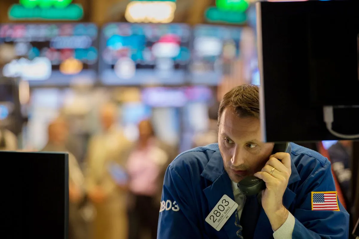 A trader works on the floor of the New York Stock Exchange at the closing bell of the Dow Jones Industrial Average on June 8, 2017. (Bryan R. Smith/AFP/Getty Images)