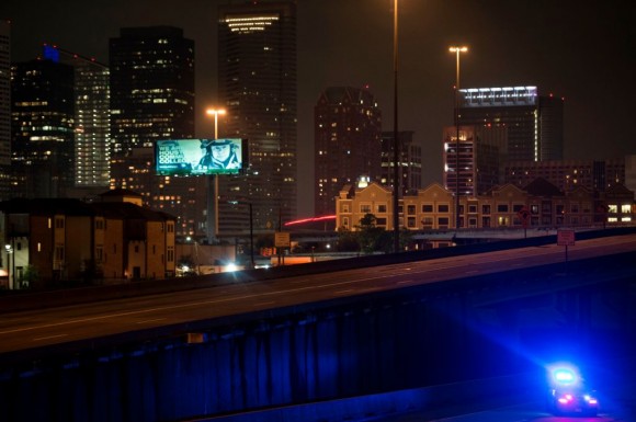 A police car is seen after the Mayor of Houston, Sylvester Turner, imposed a citywide curfew in the aftermath of Hurricane Harvey August 29, 2017 in Houston, Texas. (BRENDAN SMIALOWSKI/AFP/Getty Images)