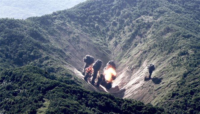 Munitions from a U.S. Air Force, U.S. Marine Corps and Republic of Korea Air Force bilateral mission explode at the Pilsung Range, South Korea.       (U.S. Air Force photo by Staff Sgt Alex Fox Echols III/Released) 