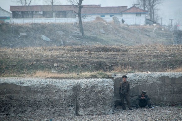 North Korean soldiers are seen on the banks of the Yalu river near Sinuiju, opposite the Chinese border city of Dandong, on April 15, 2017. (JOHANNES EISELE/AFP/Getty Images)