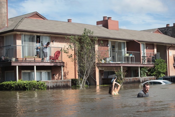 Residents wait for rescue at an apartment complex after it was inundated with water following Hurricane Harvey on August 30, 2017 in Houston, Texas.  (Scott Olson/Getty Images)