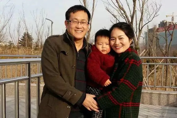 Wang Quanzhang (L), his wife, and 2-year-old son. (Photo provided)