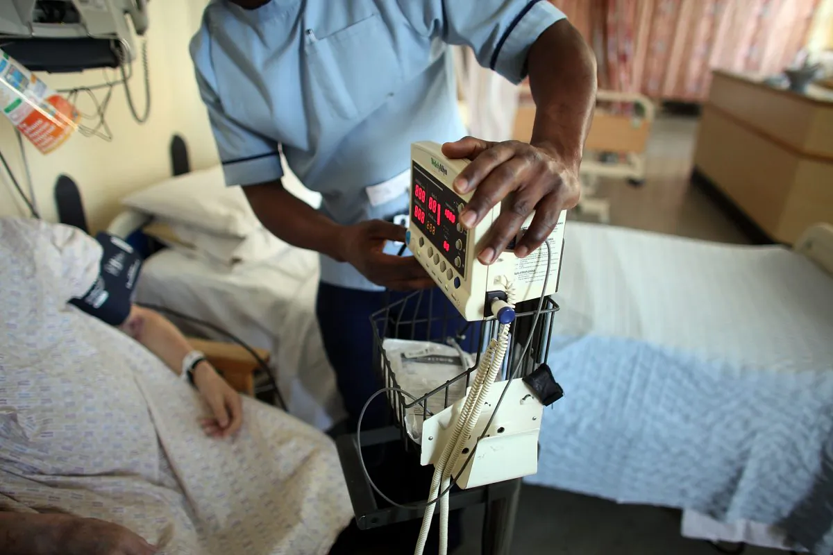 A nurse tends to recovering patients on a general ward at The Queen Elizabeth Hospital in Birmingham, England, in a file photo. (Christopher Furlong/Getty Images)