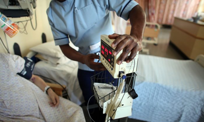 A nurse tends to recovering patients on a general ward at The Queen Elizabeth Hospital in Birmingham, England, in a file photo. (Christopher Furlong/Getty Images)