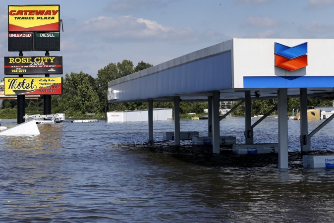 A gas station submerged under flood waters from Tropical Storm Harvey is seen in Rose City, Texas, U.S., on August 31, 2017. REUTERS/Jonathan Bachman