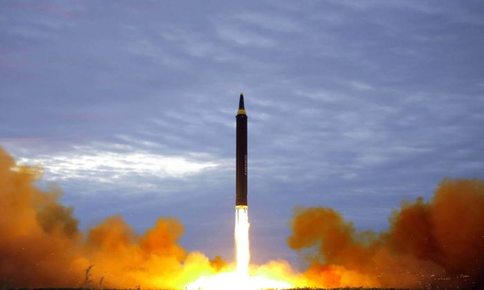 This picture from North Korea's official Korean Central News Agency shows North Korea's intermediate-range strategic ballistic rocket Hwasong-12 lifting off from the launching pad at an undisclosed location near Pyongyang. (Photo credit should read STR/AFP/Getty Images)