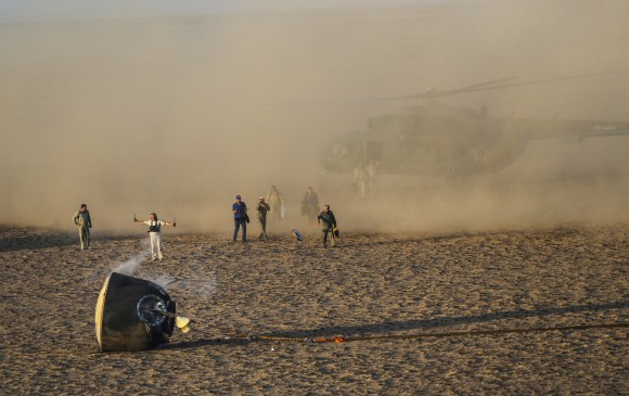 Search and rescue team approaches the Soyuz MS-04 capsule carrying the International Space Station (ISS) crew of Jack Fischer, Peggy Annette Whitson of the U.S. and Fyodor Yurchikhin of Russia after its landing near the town of Dzhezkazgan (Zhezkazgan), Kazakhstan September 3, 2017. (Reuters/Sergei Ilnitsky/Pool)