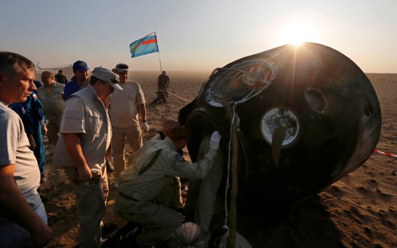 Search and rescue team open the hatch of the Soyuz MS-04 capsule carrying the International Space Station (ISS) crew of Jack Fischer, Peggy Annette Whitson of the U.S. and Fyodor Yurchikhin of Russia after its landing near the town of Dzhezkazgan (Zhezkazgan), Kazakhstan September 3, 2017. (Reuters/Sergei Ilnitsky/Pool)