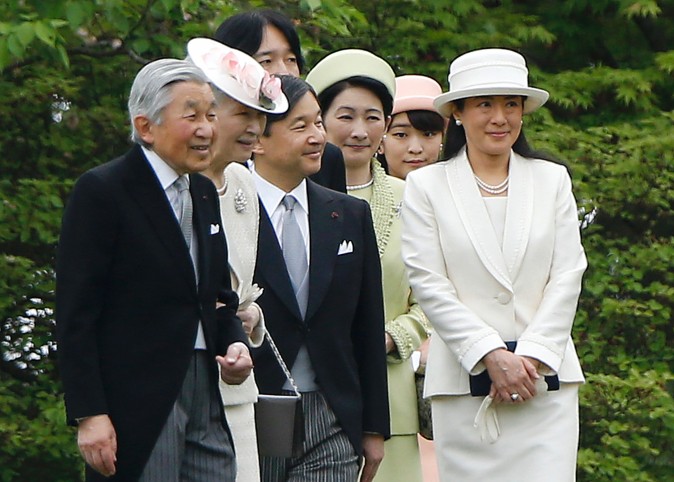 Japan's Emperor Akihito (L), Empress Michiko (2nd L), Crown Prince Naruhito (3rd L) and his wife Princess Masako (R), Prince Akishino (4th L) and his wife Princess Kiko (3rd R) and Princess Mako (2nd R) walk down a hill to greet guests during the spring garden party at the Akasaka Palace imperial garden in Tokyo on April 27, 2016. The Japanese royal family host garden parties annually, once in the spring and another in the autumn.  (SHIZUO KAMBAYASHI/AFP/Getty Images)