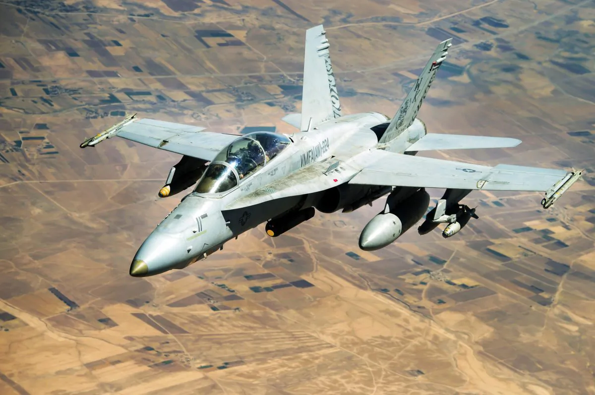 A Navy F-18 Growler flies over Syria in a mission supporting Operation Inherent Resolve to desroy ISIS, on Aug. 4. (Air Force photo/Staff Sgt. Trevor T. McBride)