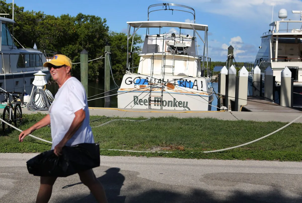 A woman at the Founders Park Marina continues to prepare for Hurricane Irma in Islamorada, Florida on September 7, 2017.The marina is on one of Florida’s barrier islands already under mandatory evacuation order. It is all but empty except for a few main stays who refuse to leave. (Marc Serota/Getty Images)
