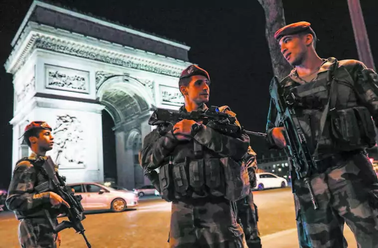 French soldiers stand guard at the Arc de Triomphe near the Champs Elysées in Paris after a shooting on April 20. (THOMAS SAMSON/AFP/GETTY IMAGES)