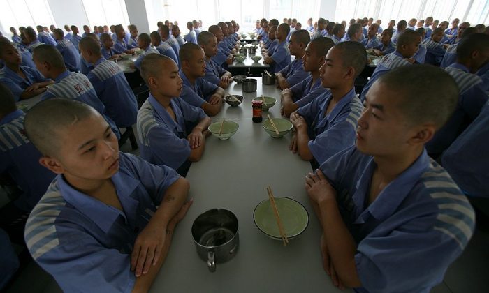 Inmates wait for lunch at the Chongqing Juvenile Offender Correctional Center. (Photo by China Photos/Getty Images)