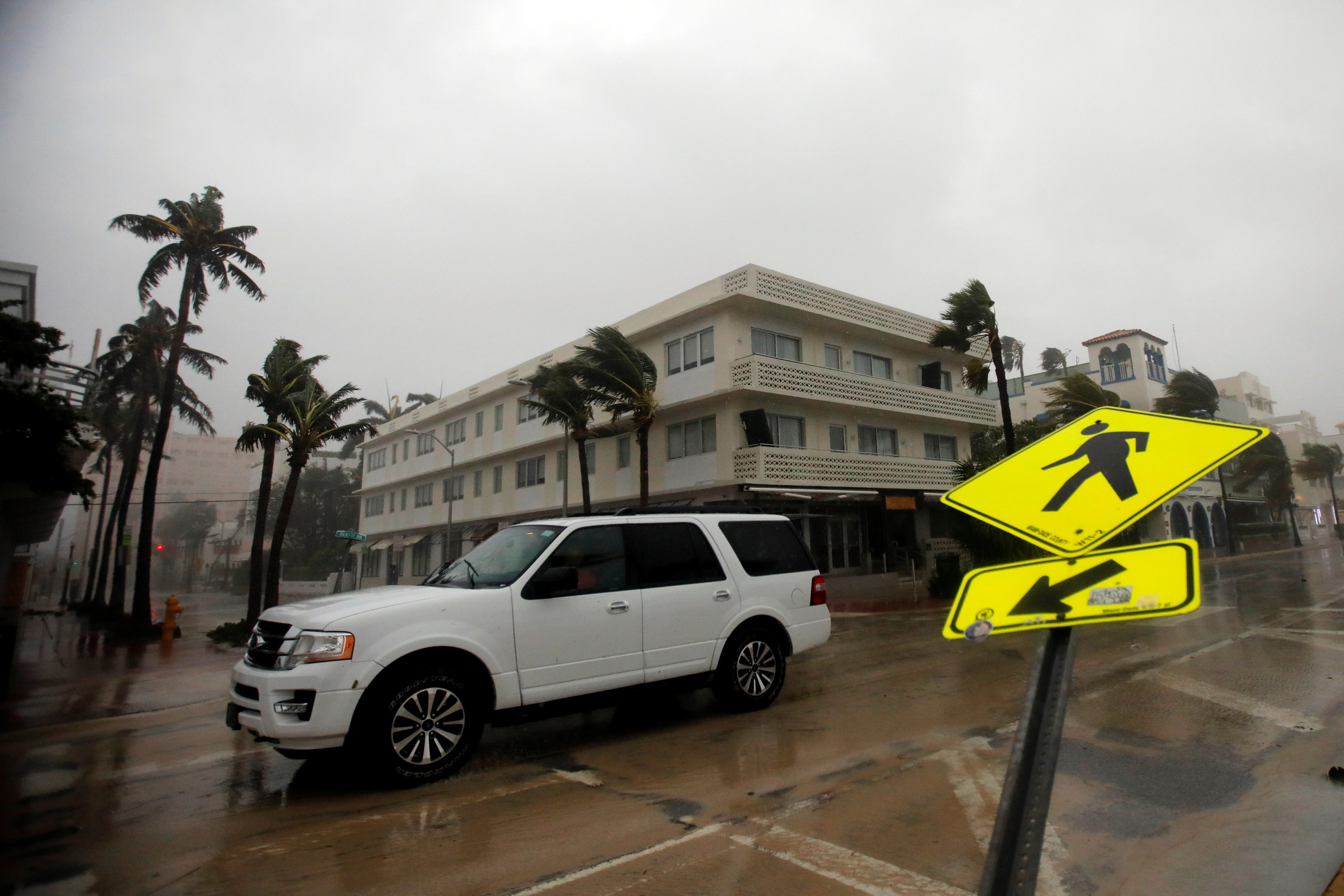 A vehicle drives along Ocean Drive in South Beach as Hurricane Irma arrives at south Florida, in Miami Beach, Florida on Sept. 10, 2017. (REUTERS/Carlos Barria)