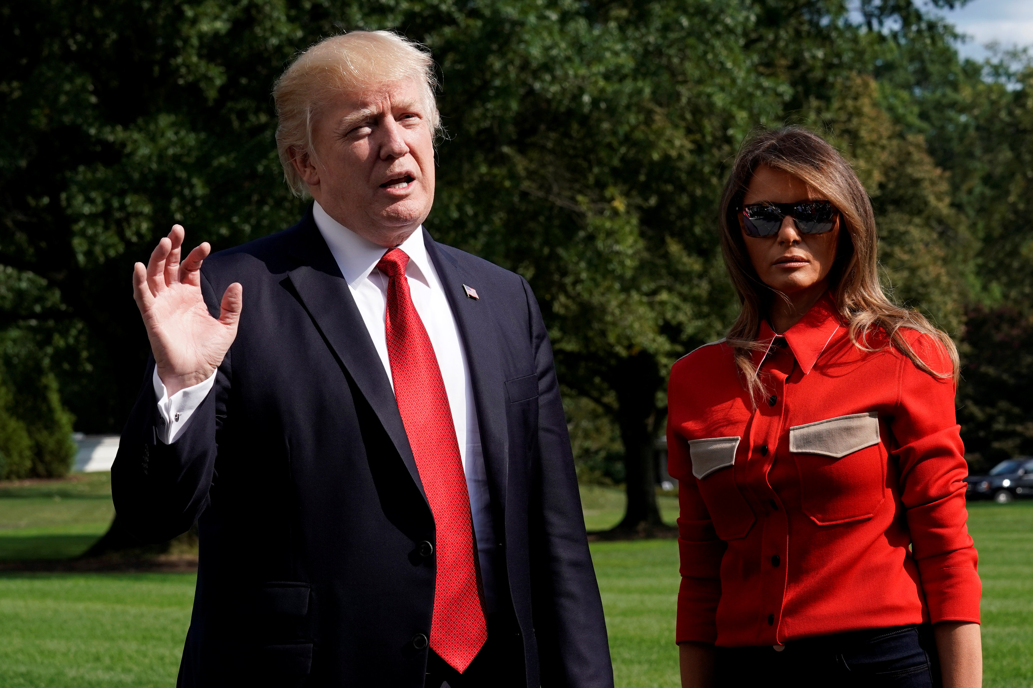 U.S. President Donald Trump talks to the media about Hurricane Irma, next to First lady Melania Trump, on the South Lawn of the White House upon their return to Washington from Camp David on Sept. 10, 2017. (REUTERS/Yuri Gripas)