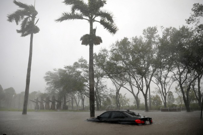 A partially submerged car is seen at a flooded area in Coconut Grove as Hurricane Irma arrives at south Florida, in Miami, Florida, U.S., September 10, 2017. (REUTERS/Carlos Barria)