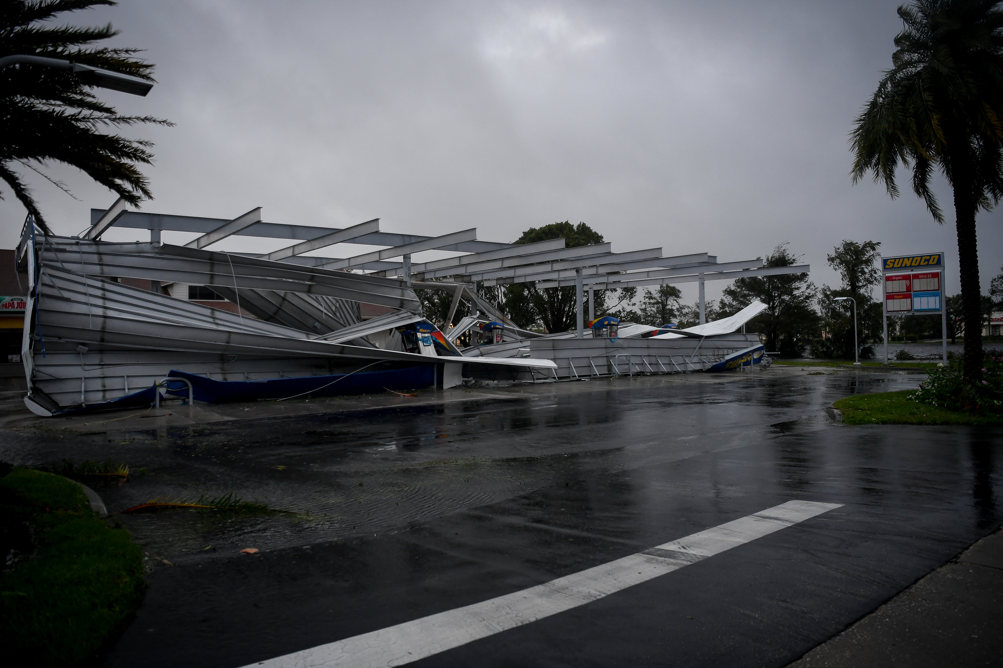 The crumbled canopy of a gas station damaged by Hurricane Irma is seen in Bonita Springs, Florida on Sept. 10, 2017. (REUTERS/Bryan Woolston)