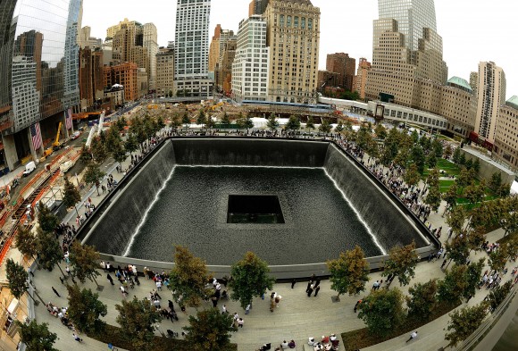 Families line up against the wall of the South Memorial pool during tenth anniversary ceremonies at the site of the World Trade Center September 11, 2011, in New York. (Timothy A. Clary/AFP/Getty Images)