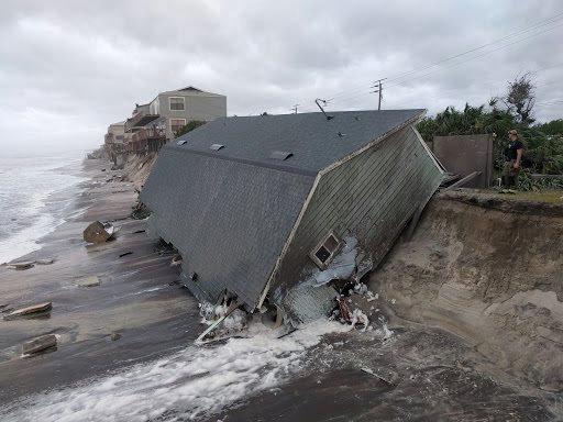 A firefighter views a collapsed coastal house after Hurricane Irma passed the area in Vilano Beach, Florida on Sept. 11, 2017. (St Johns County Fire Rescue/Handout via ReuterS)
