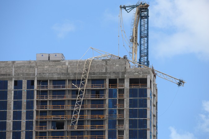 A collapsed crane on a building under construction is pictured after passing of Hurricane Irma in Key Biscayne, Florida on Sept. 11, 2017. (REUTERS/Carlo Allegri)