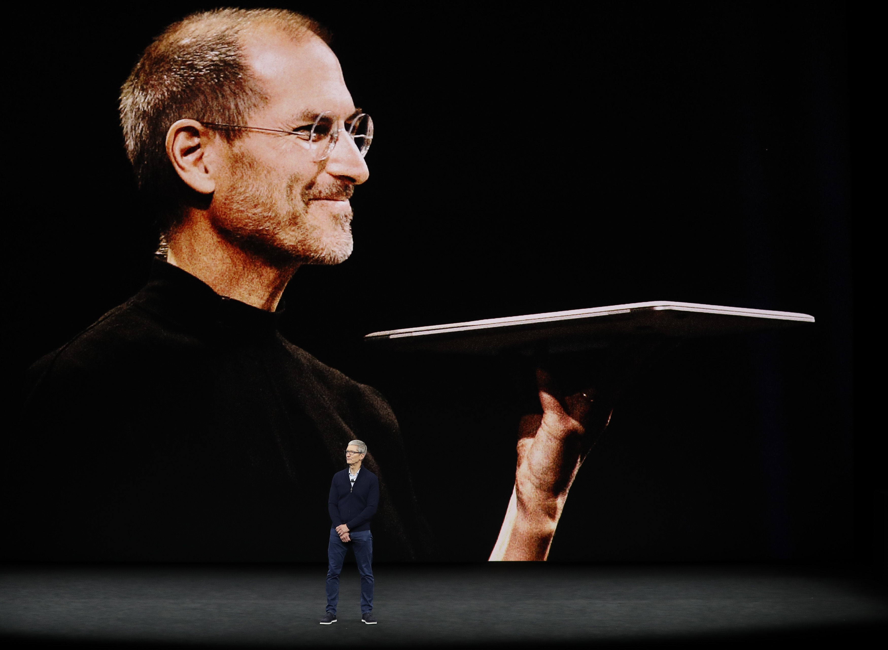 Tim Cook, CEO of Apple, speaks as a tribute video to the late Apple co-founder Steve Jobs plays behind him during a product launch event in Cupertino, Calif., on Sept. 12, 2017. (REUTERS/Stephen Lam)