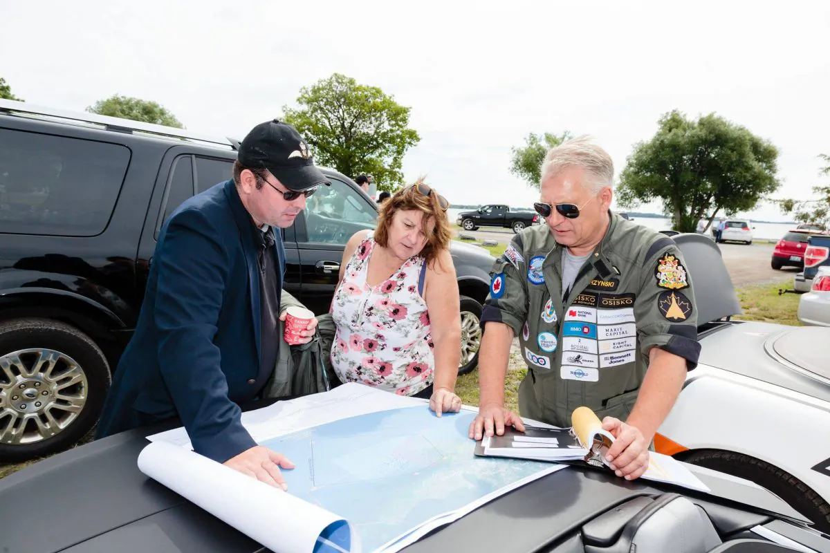 Raise the Arrow expedition leader John Burzynski (R) with expedition archeologist Scarlett Janusas and Richard Mayne, a historian with the Royal Canadian Air Force. (Raise the Arrow)