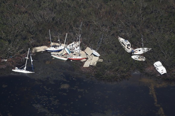 Boats are pictured washed ashore in an aerial photo in the Keys in Marathoni, Florida, U.S., September 13, 2017. REUTERS/Carlo Allegri