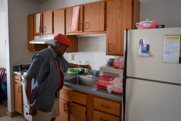 Two days after Hurricane Irma caused a power and water outage, William James, 83, checks the faucet for water, in his room at Cypress Run, an assisted living facility, in Immokalee, Florida, U.S., September 12, 2017. Picture taken September 12, 2017. REUTERS/Bryan Woolston