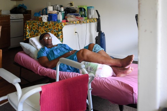 Two days after Hurricane Irma, Mary Mitchell, 82, lays on a hospital bed in her room, without power, food, or water at Cypress Run, an assisted living facility, in Immokalee, Florida, U.S., September 12, 2017. Picture taken September 12, 2017. REUTERS/Bryan Woolston