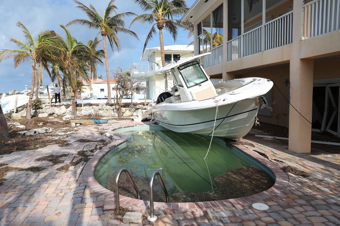  A boat is next to a home after Hurricane Irma passed through Duck Key, Fla., on Sept. 13. (Joe Raedle/Getty Images)