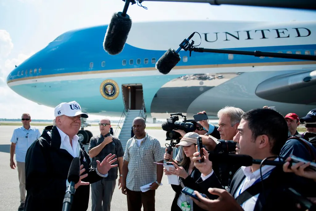 US President Donald Trump speaks to the press on arrival in Fort Myers, Florida, on September 14, 2017. He addresses questions about whether his tax reform plan would benefit the high-income households. (BRENDAN SMIALOWSKI/AFP/Getty Images)