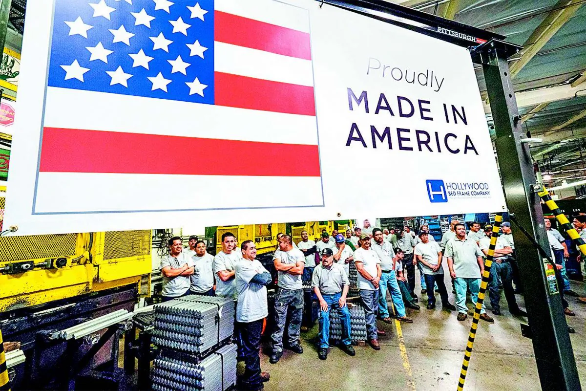 Workers at the Hollywood Bed Frame Co. in Commerce, Calif., attend an event on April 14 to mark the company’s expansion, with 100 new local jobs. (ROBYN BECK/AFP/GETTY IMAGES)