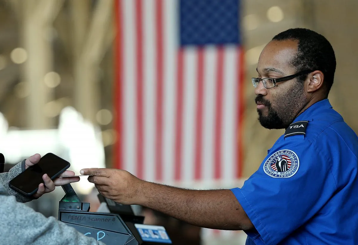 A TSA officer checks travel documents at Reagan National Airport in Arlington, Va., Nov. 25, 2015. (Win McNamee/Getty Images)