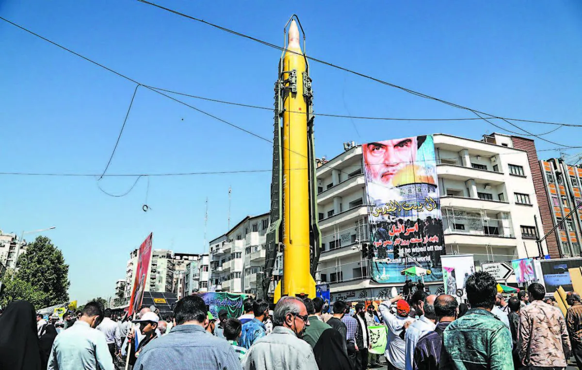 A Shahab-3 medium-range missile is displayed during a rally marking Al-Quds (Jerusalem) Day in Tehran, Iran, on June 23. Chants against the Saudi royal family and the ISIS terrorist group mingled with the traditional cries of “Death to Israel” and “Death to America.” (STR/AFP/Getty Images) 