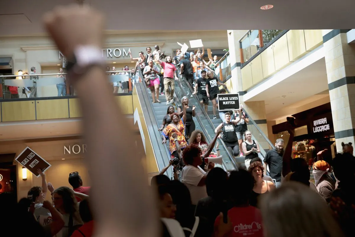 Demonstrators march through the West County Mall protesting the acquittal of former St. Louis police officer Jason Stockley on September 16, 2017 in St. Louis, Missouri. The St. Louis area is bracing for a second day of protests following yesterday's acquittal of Stockley, who was charged with first-degree murder last year following the 2011 shooting of Anthony Lamar Smith.   U2 cancelled its show scheduled Saturday night due to the protests. (Scott Olson/Getty Images)