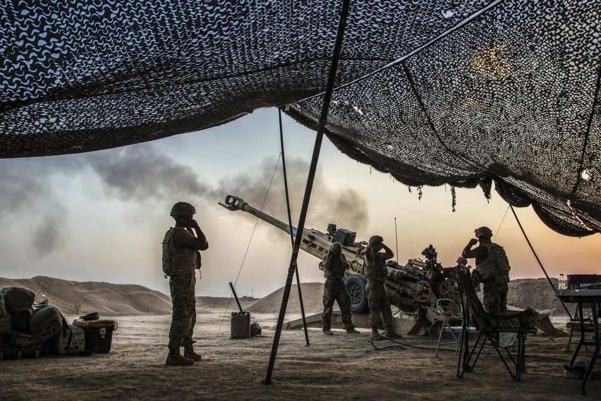 U.S. Soldiers fire a howitzer to support Iraqi forces in northern Iraq on Aug. 15, while supporting Operation Inherent Resolve. (Army photo by Cpl. Rachel Diehm)