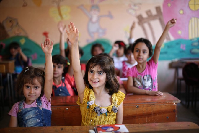 Syrian students in a school  in the rebel-held Eastern Ghouta town of Douma on Sept. 18, 2017 Syria's six-year conflict has ravaged its infrastructure and caused losses to its economy of $226 billion, according to estimates published by the World Bank. (AMER ALMOHIBANY/AFP/Getty Images)