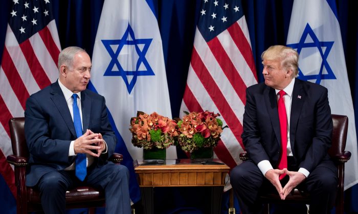 President Donald Trump listens while Israel's Prime Minister Benjamin Netanyahu makes a statement for the press before a meeting at the Palace Hotel during the 72nd session of the United Nations General Assembly in New York on Sept. 18, 2017. (BRENDAN SMIALOWSKI/AFP/Getty Images)