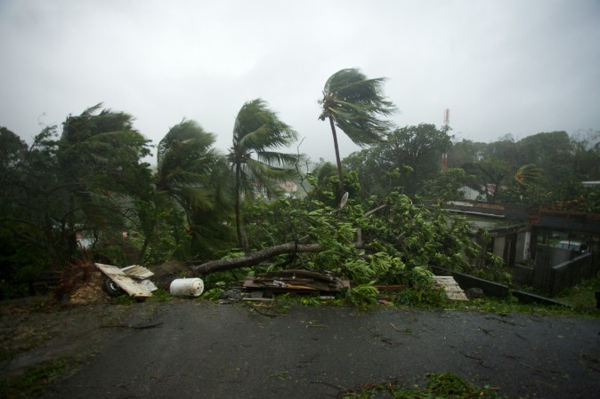 A picture taken on Sept. 19, 2017 shows the powerful winds and rains of hurricane Maria battering the city of Petit-Bourg on the French overseas Caribbean island of Guadeloupe. Hurricane Maria strengthened into a "potentially catastrophic" Category Five storm as it barrelled into eastern Caribbean islands still reeling from Irma, forcing residents to evacuate in powerful winds and lashing rain. (CEDRIK-ISHAM CALVADOS/AFP/Getty Images)