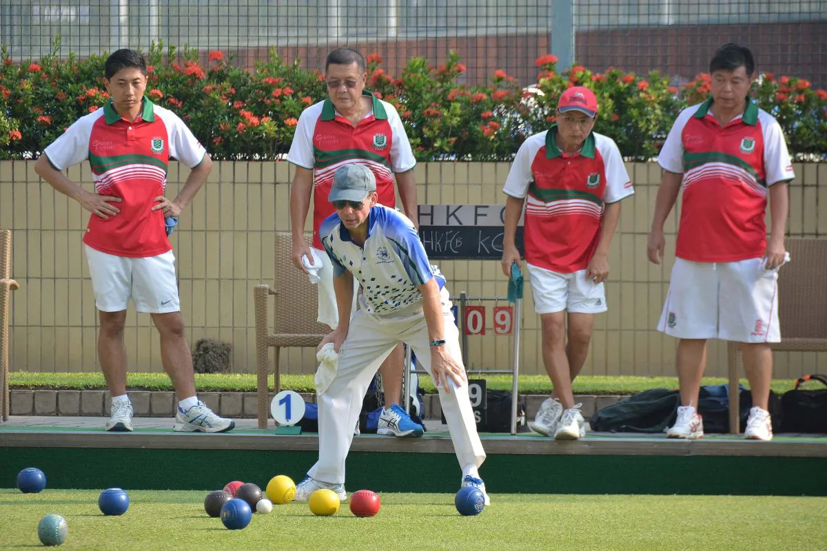 Neil Harrington (in front) from Hong Kong Football Club B team watches anxiously a bowl delivered by his teammate in the league match against Kowloon Cricket Club..  He lost the match by a shot allowing KCC to edge closer to league leaders Hong Kong Football Club A. (Stephanie Worth)