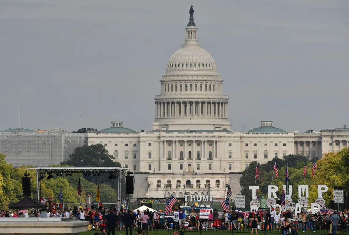 Demonstrators wave national flags in front of the United States Capitol in a pro-Trump 'Mother of All Rallies' on the National Mall in Washington, D.C. on Sept. 16, 2017.
Supporters of President Donald Trump gathered in the US capital to show support of "free-speech" and to celebrate America. (PAUL J. RICHARDS/AFP/Getty Images)