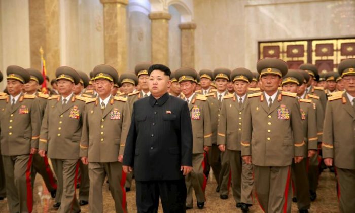 North Korean dictator Kim Jong-Un and other communist officials at an undisclosed location in North Korea in this picture released by North Korea's official Korean Central News Agency. (Korean Central News Agency)