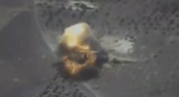 A still image taken from a video footage and released by Russia's Defence Ministry on Sept. 22, 2017, shows a missile hitting a building which Defense Ministry said was a Jabhat al-Nusra target in Syria. (Russian Defence Ministry/Handout via REUTERS TV)