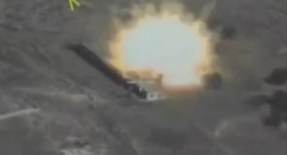 A still image taken from a video footage and released by Russia's Defense Ministry on Sept. 22, 2017, shows a missile hitting a building which Defense Ministry said was a Jabhat al-Nusra target in Syria. (Russian Defence Ministry/Handout via REUTERS TV)