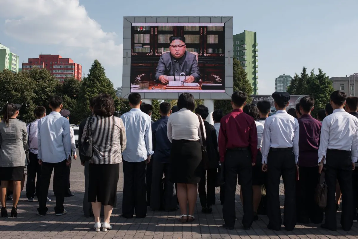 North Koreans listen to a television broadcast of a statement by communist dictator Kim Jong Un, in Pyongyang, North Korea, on Sept. 22, 2017. (ED JONES/AFP/Getty Images)