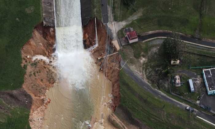 An aerial view shows the damage to the Guajataca dam in the aftermath of Hurricane Maria, in Quebradillas, Puerto Rico September 23, 2017. (Reuters/Alvin Baez)