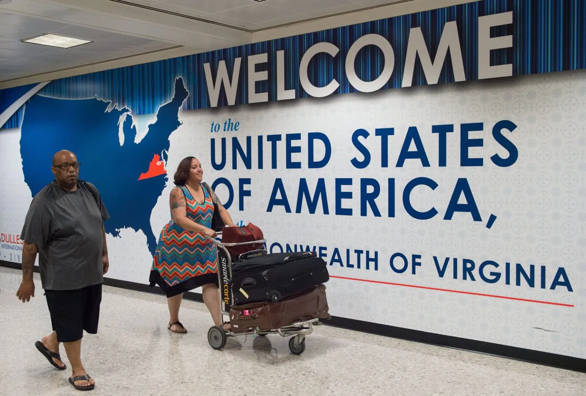 International travelers leave the Customs and Immigration area of Dulles International Airport in Dulles, Va., on June 29, 2017. (Paul J. Richards/AFP/Getty Images)