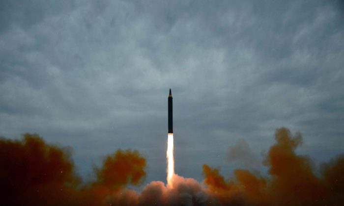 This picture from North Korea’s official Korean Central News Agency (KCNA) taken on Aug. 29, 2017, and released on Aug. 30 shows North Korea’s intermediate-range strategic ballistic rocket Hwasong-12 lifting off from the launching pad at an undisclosed location near Pyongyang. North Korea launched an intercontinental ballistic missile (ICBM)
 on Tuesday after 74 days without a missile launch.
 (STR/AFP/GETTY IMAGES)